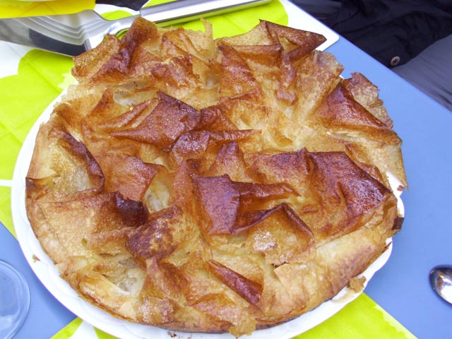 Golden flaky pastry of an apple filled Toutiere pie, specialty of south western France 'The Greedy South-West'