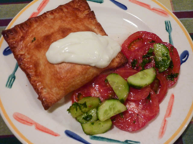 Middle Eastern Turnover cooked with a tomato & cucumber salad
