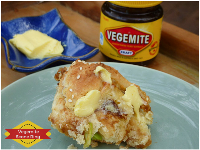 chunk of vegemite scone ring with dab of melting butter and jar of vegemite in background