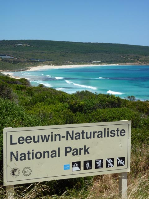 sign in front of the ocean for leeuwin-naturaliste national park in western australia