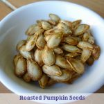 white dish of roasted pumpkin seeds made from pumpkin food scraps