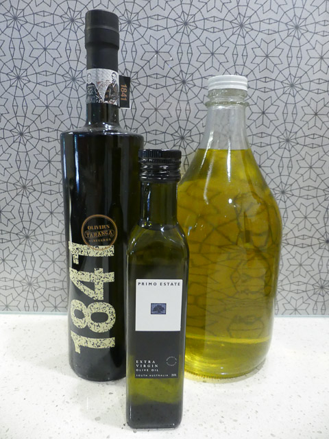 three bottles of olive oil