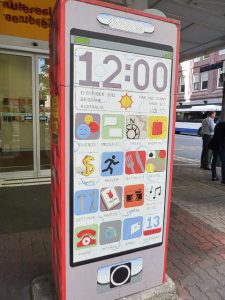 traffic signal box painted with a digital clock and activity icons, Brisbane