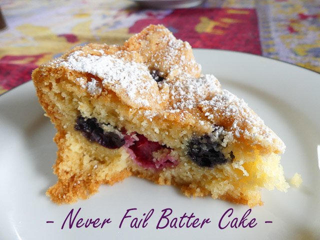 slice of blueberry and rapebrry batter cake dusted with icing sugar