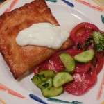 Middle Eastern Turnover cooked with a tomato & cucumber salad