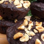 Black bean brownie muffins with roasted hazelnuts on top