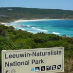 sign in front of the ocean for leeuwin-naturaliste national park in western australia