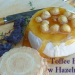 Cheeseboard including brie topped with golden toffee and hazelnuts