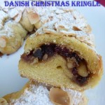 Danisk Christmas Kringle with cranberry folling dusted with icing sugar and flaked almonds