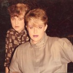 two teenage girls with 1980's clothing, dyed fringe haircuts and makeup