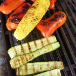 capsicum, corn and zucchini grilling on a barbeque BBQ
