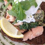 hot smoked salmon with horseradish cream and a poached egg