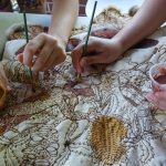 Ashley & Tait McGregor creating their work on the Brisbane Community Cloak, 2016