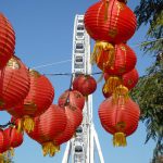 Red Chinese lanterns contrast against a blue sky at a Queensland Food Festivals