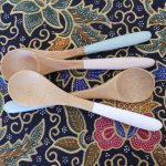 four small bamboo teaspoons with pastel coloured handles